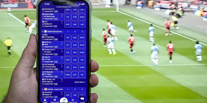 Plataforma de apostas esportivas em funcionamento durante jogo de futebol televisionado